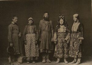 Udmurts. Men and women in traditional folk costumes
