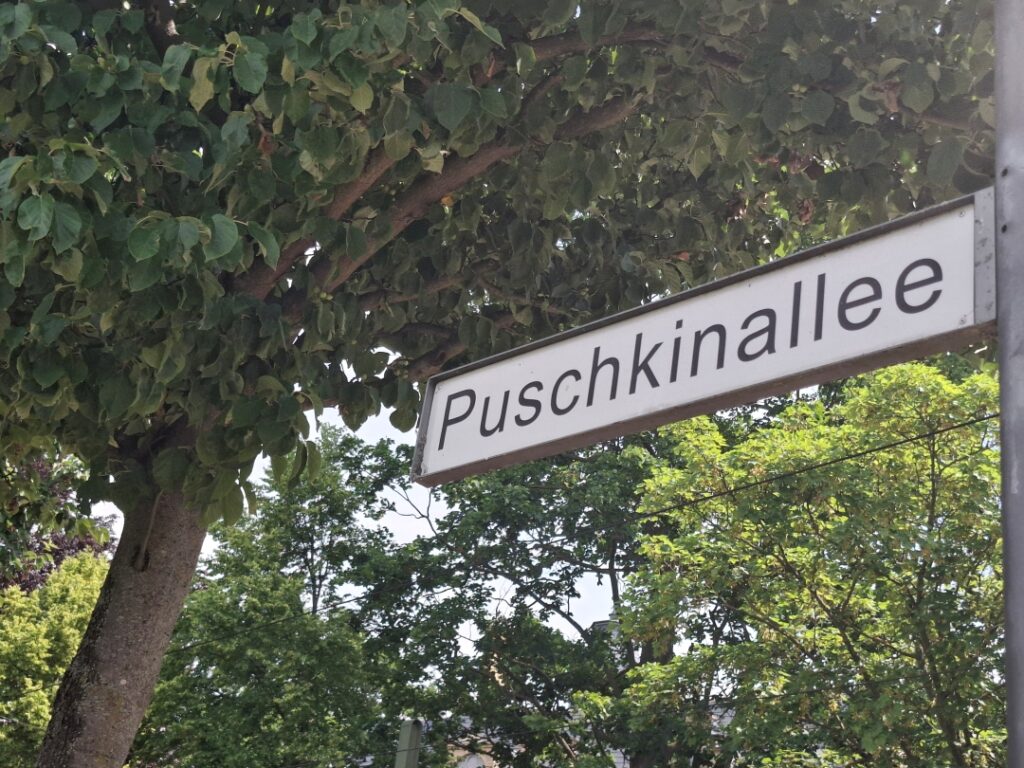 A white plate with a name of the street